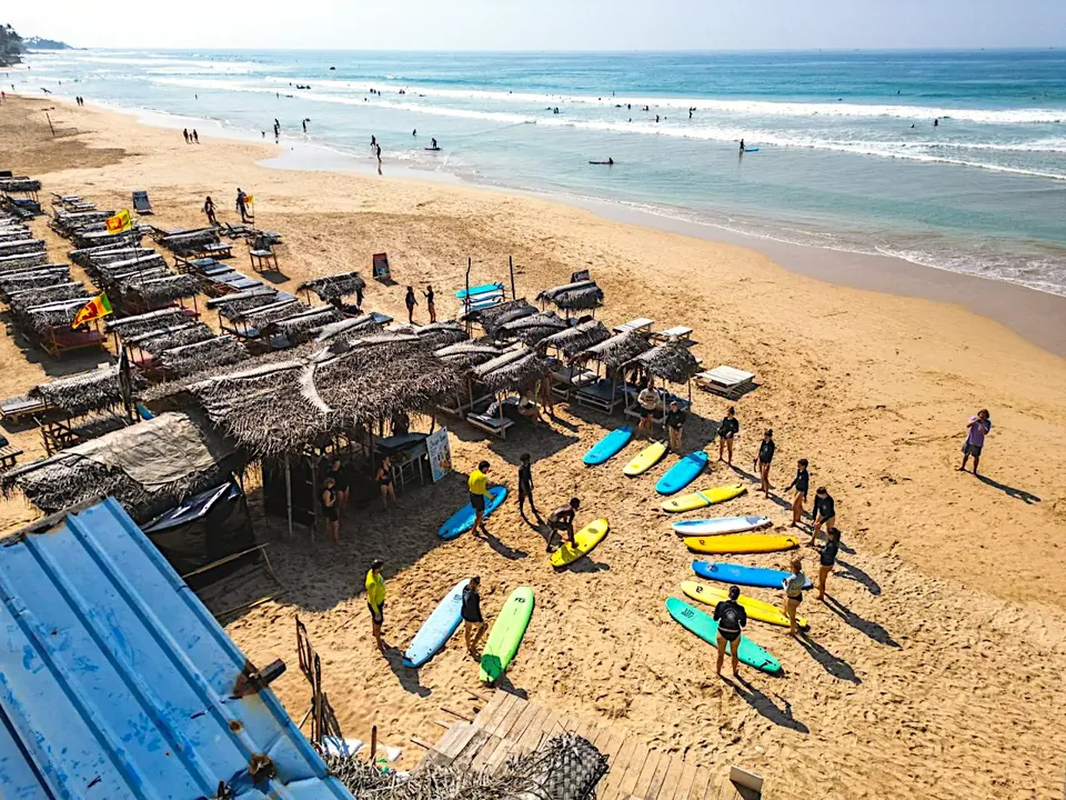 Sun beds and shaded huts overlooking Kabalana Beach