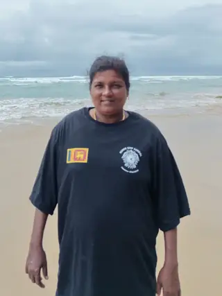 Shanthi welcoming visitors at the beach